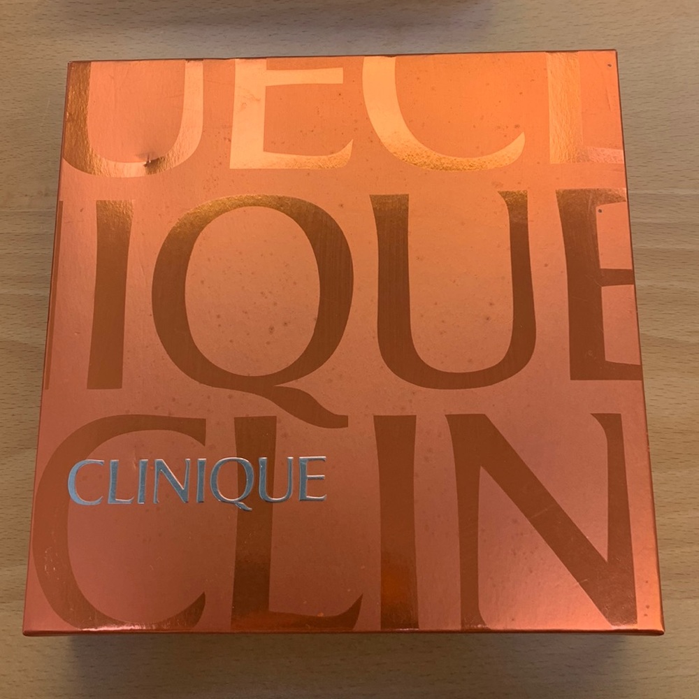 Clinique Perfectly happy perfume, body cream, perfume roller balm and lipgloss.